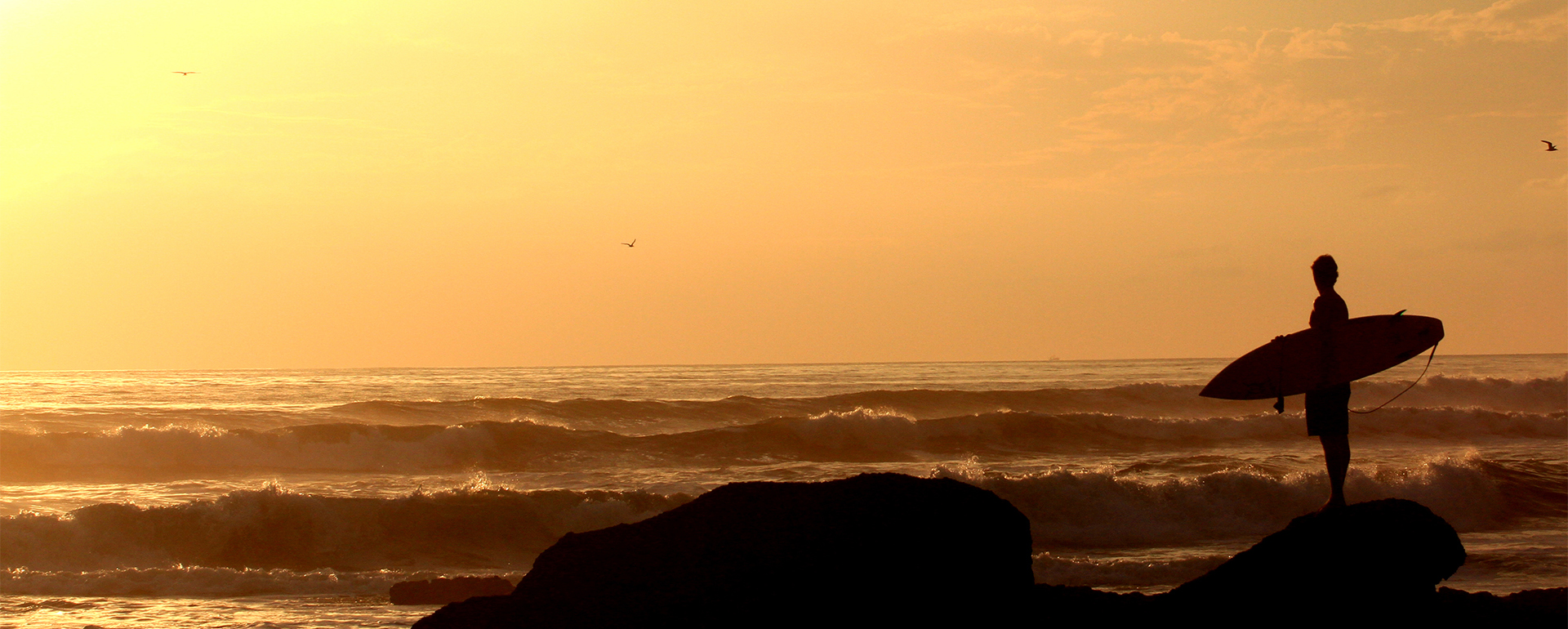 Surfers entering the water in Cornwall