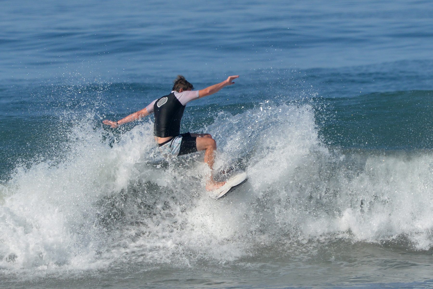 Surfer turning off the lip